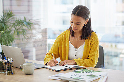 Buy stock photo Shot of a young businesswoman working in a modern office at work