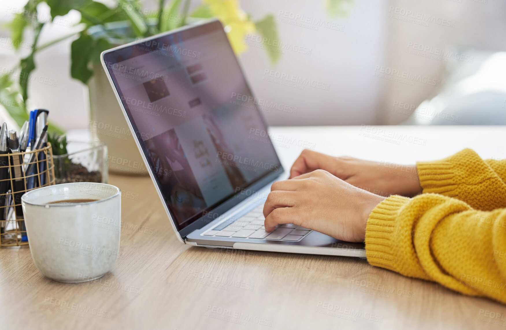 Buy stock photo Shot of an unrecognizable businessperson using a laptop at work