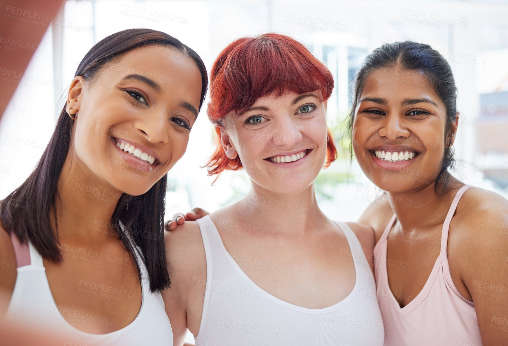Buy stock photo Portrait of a group of sporty young women taking selfies together in a yoga studio