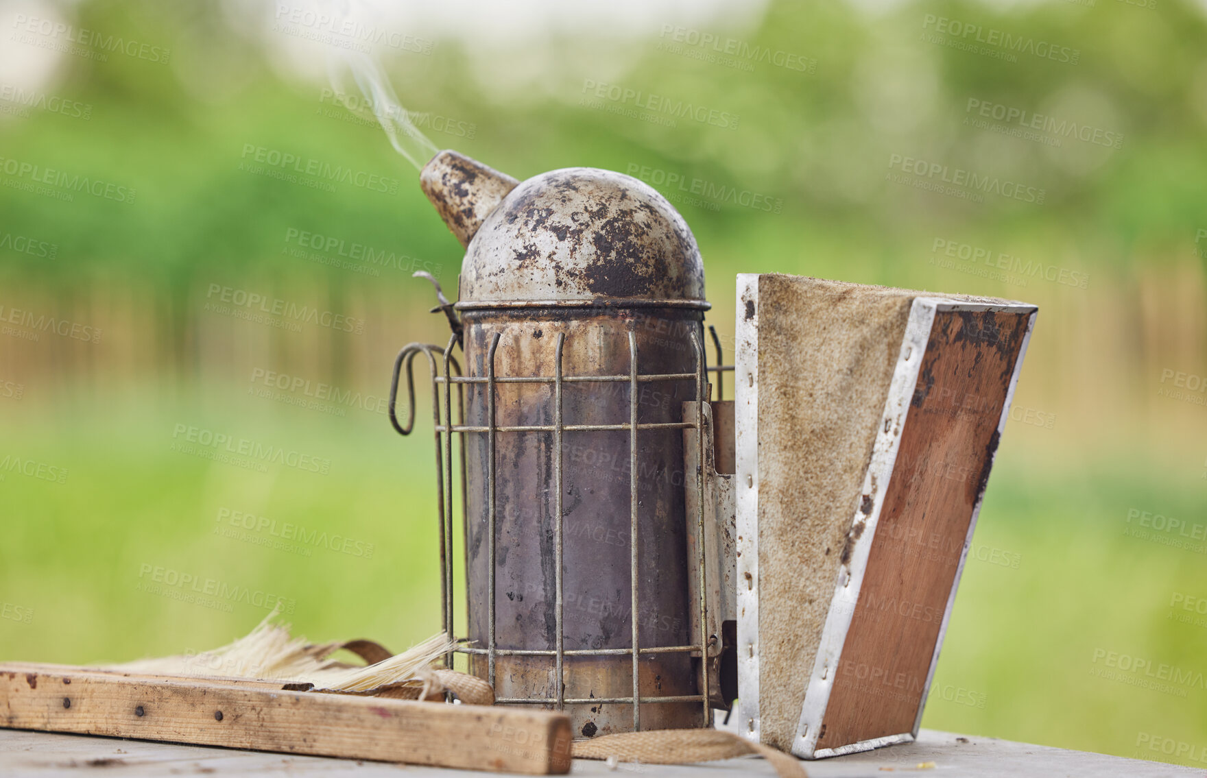 Buy stock photo Shot of a bee smoker on a farm