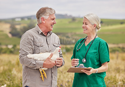 Buy stock photo Shot of a man having a discussion with a veterinarian on a poultry farm