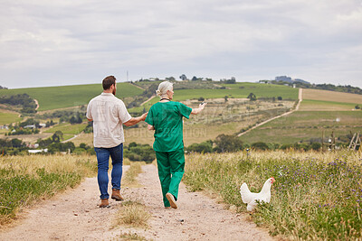 Buy stock photo Back, pointing and veterinarian talking to farmer outdoor for agriculture, healthcare or sustainability. Appointment, medical and walking with veterinary woman speaking to man on farm for checkup