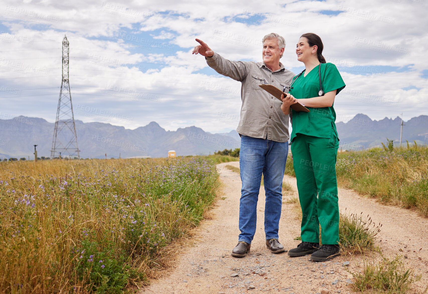 Buy stock photo Shot of a man having a discussion with a veterinarian on a poultry farm