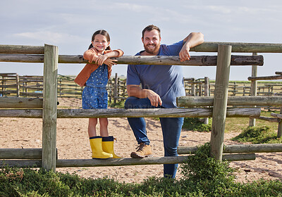 Buy stock photo Shot of a man and his young daughter spending time together on their farm