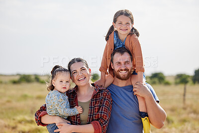 Buy stock photo Shot of a couple on a farm with their two adorable daughters