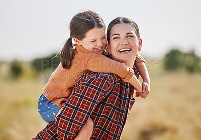 Buy stock photo Shot of a woman and her daughter spending time outside on their farm