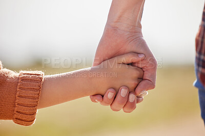 Buy stock photo Cropped shot of a little girl holding her mother's hand