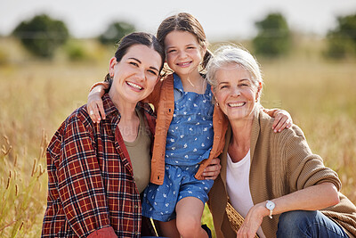 Buy stock photo Shot of an adorable little girl on a farm with her mother and grandmother