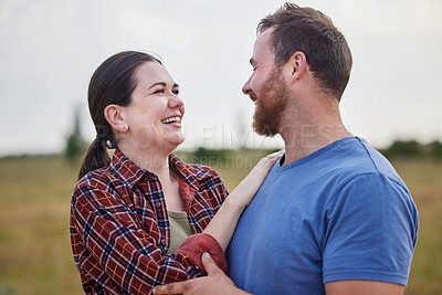 Buy stock photo Shot of a couple standing together on a farm