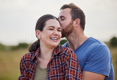 Buy stock photo Shot of a couple standing together on a farm