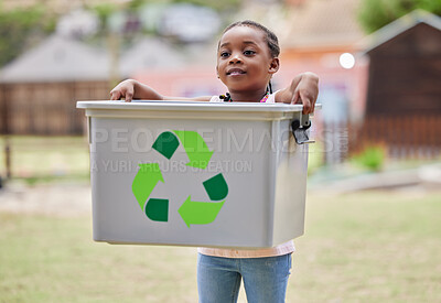 Buy stock photo Shot of a little girl carrying a recycling box outside