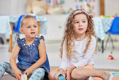 Buy stock photo Shot of two little girls sitting next to each other in class