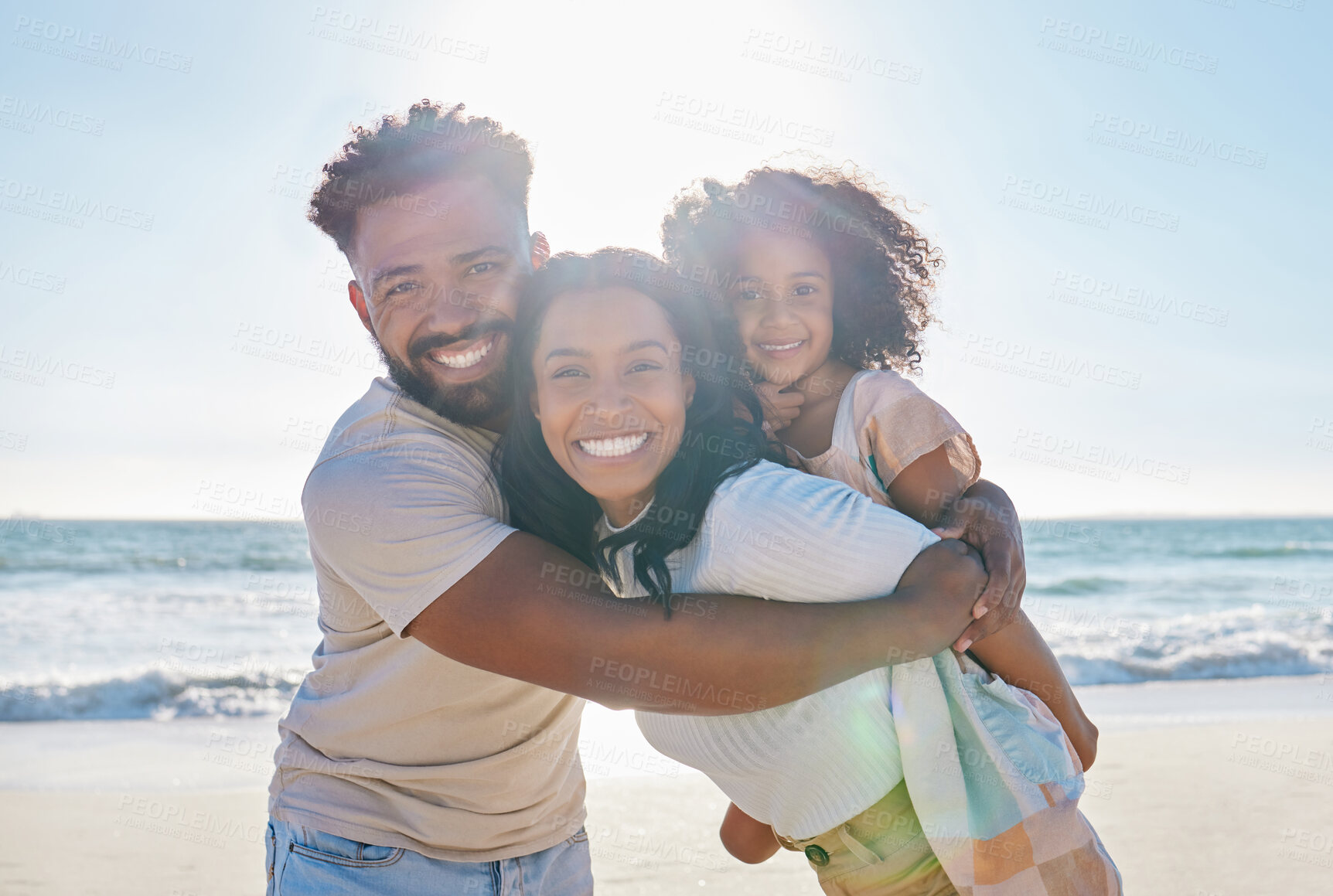 Buy stock photo Beach, vacation and portrait of a happy family with a child excited for a sea or ocean holiday together in happiness. Water, father and young mother playing piggyback with a kid on a summer trip