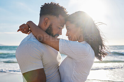 Buy stock photo Couple hug at beach, love and travel with sun and sea, affection and care with vacation in Mexico. Commitment, support and trust with relationship, tourism and tropical with people in embrace outdoor