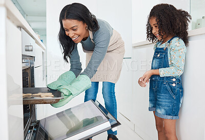 Buy stock photo Mother, daughter or baking by oven in kitchen with cookies preparation, learning recipe or curious for process. Happy family, woman or girl with biscuits in tray for culinary skill or bonding in home