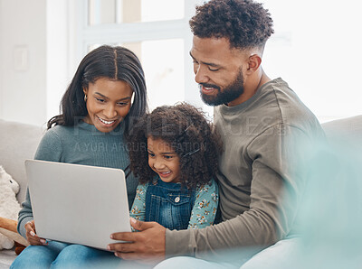 Buy stock photo Shot of a family using a laptop at home