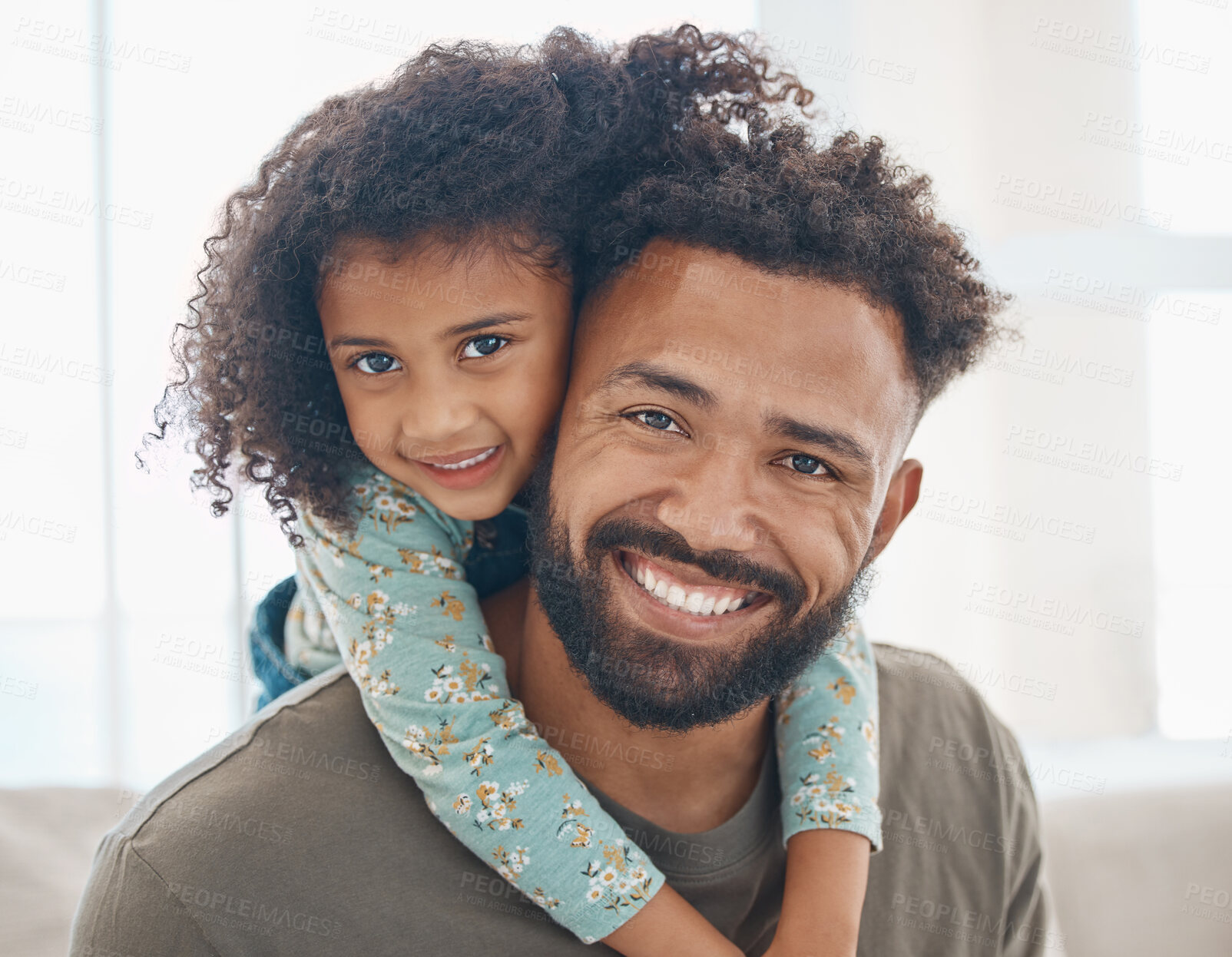 Buy stock photo Shot of a father and his little daughter relaxing together at home