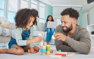 Buy stock photo Shot of a father and daughter playing at home