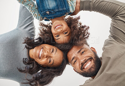 Buy stock photo Shot of a couple huddling and holding each other at home