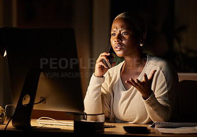 Buy stock photo Shot of a young businesswoman looking stressed out while talking on a cellphone and working on a computer in an office at night