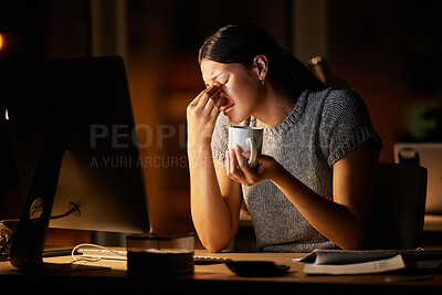 Buy stock photo Shot of a young businesswoman looking stressed out while working on a computer in an office at night