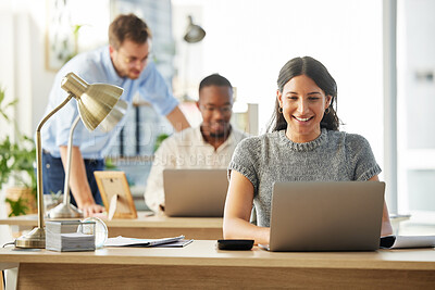 Buy stock photo Shot of a group of young businesspeople working together in their office