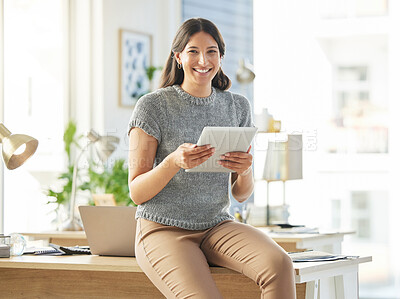 Buy stock photo Shot of a young businesswoman using a digital tablet in her office