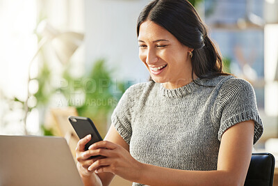 Buy stock photo Shot of a young businesswoman using her smartphone to send a text message