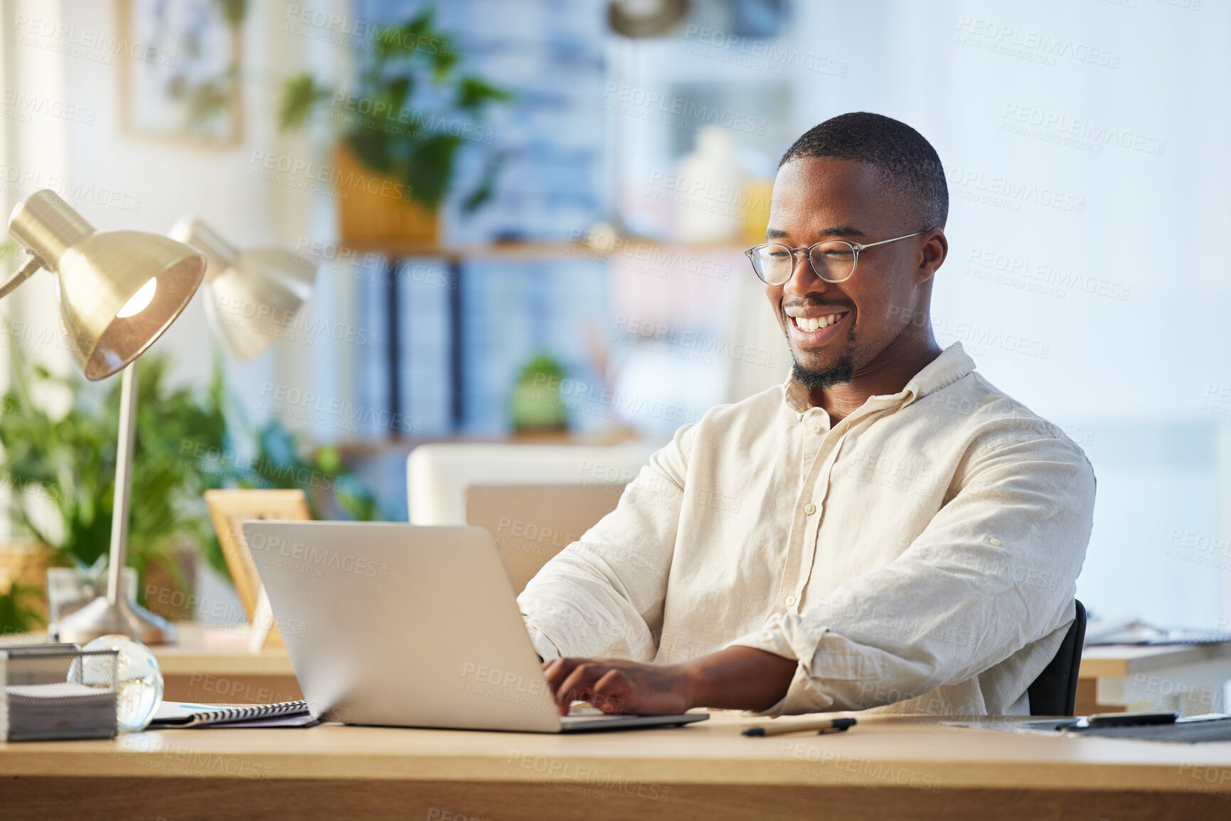 Buy stock photo Laptop, business and black man typing, writer and working on web project in office workplace. Smile, computer and African male professional, copywriter and writing email, report or research proposal.