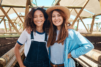 Buy stock photo Portrait of two young women working on a farm