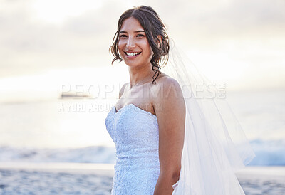 Buy stock photo Shot of a beautiful woman on the beach on her wedding day