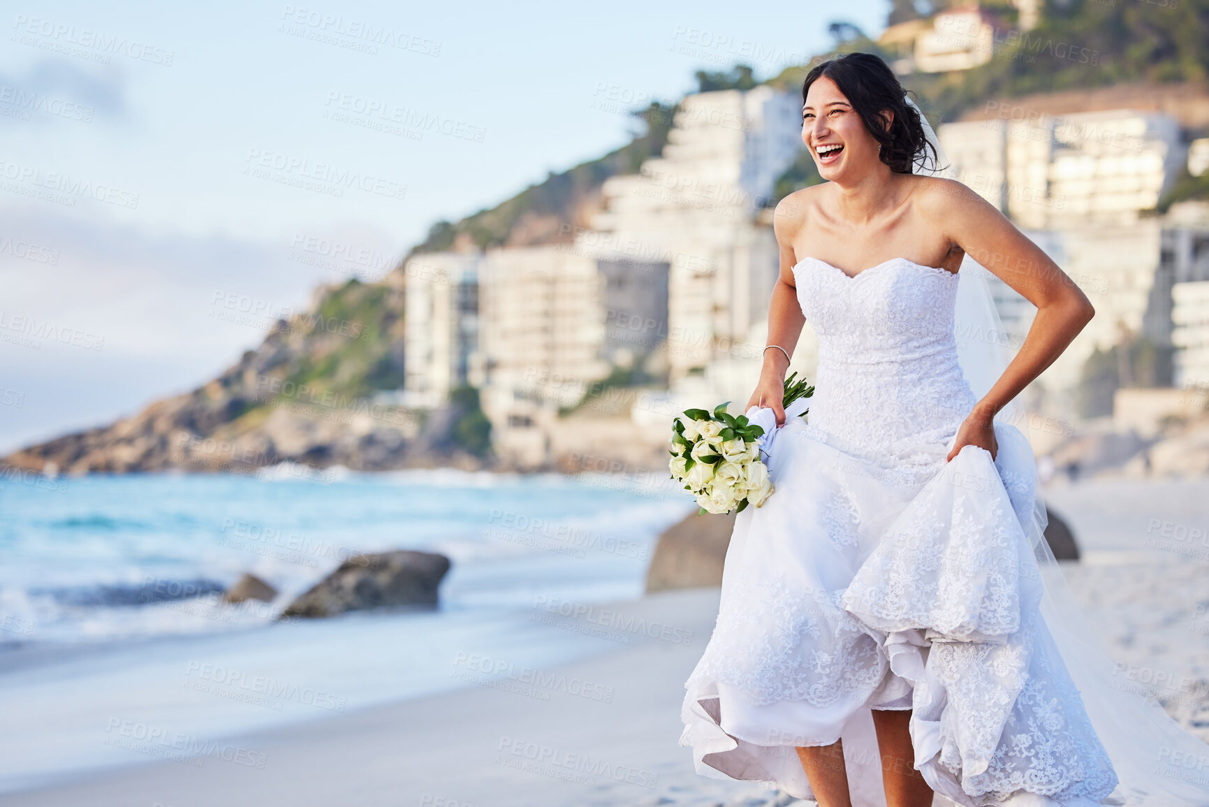 Buy stock photo Shot of a beautiful woman on the beach on her wedding day