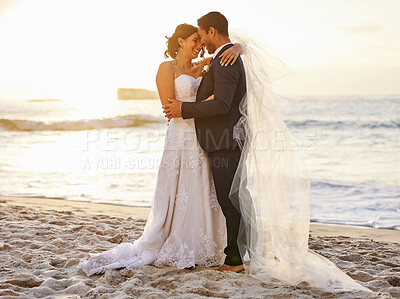 Buy stock photo Beach, wedding and couple hug at ocean for love, union and celebration against a nature background. Summer, marriage and happy groom with bride embracing at sea ceremony, smile and romantic in Bali