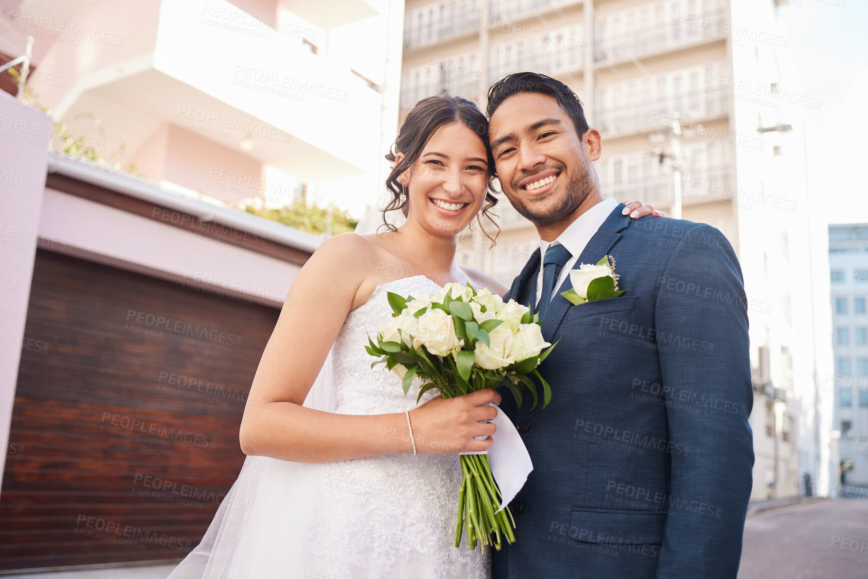 Buy stock photo Shot of a beautiful couple out in the city on their wedding day