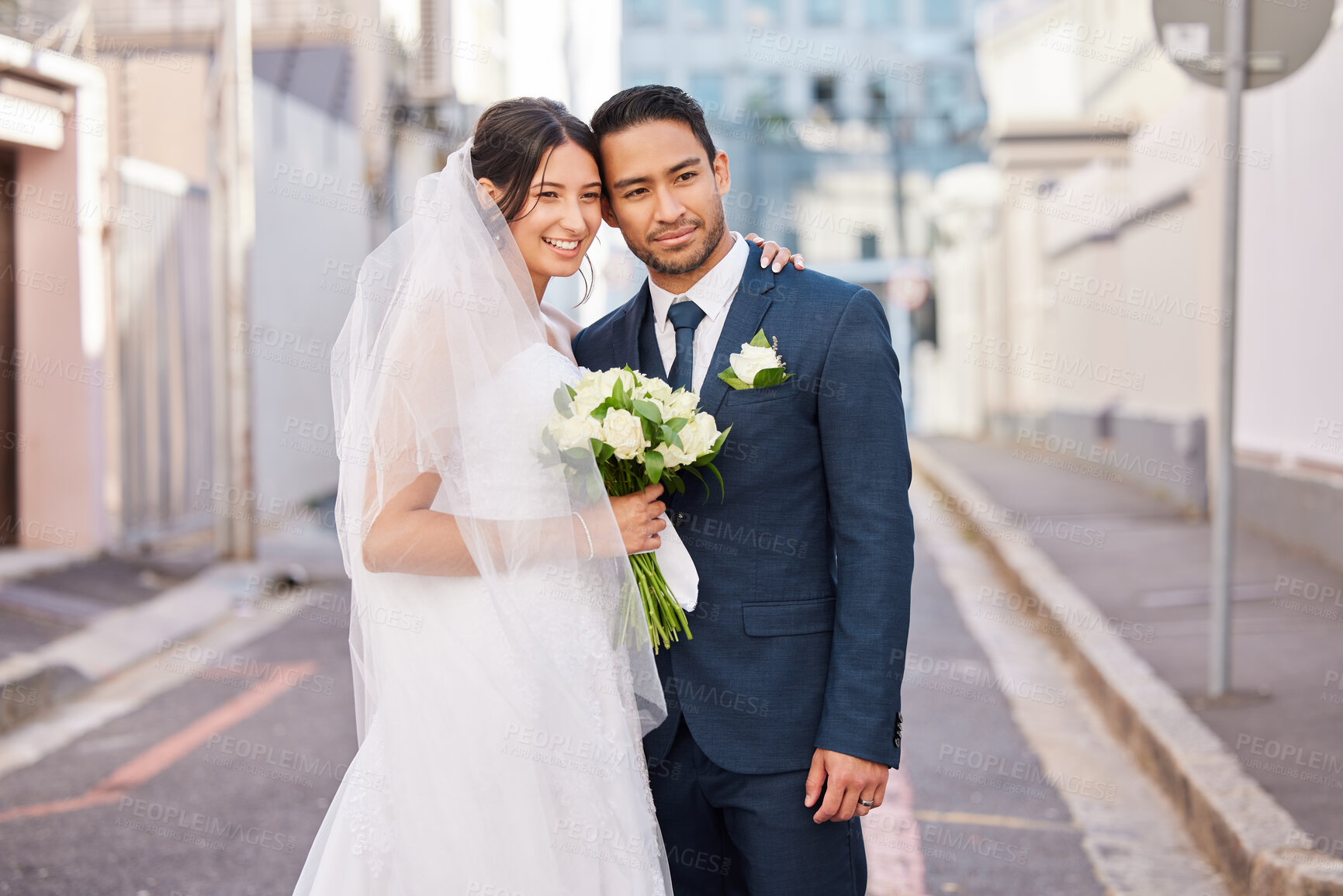 Buy stock photo Shot of a beautiful couple out in the city on their wedding day