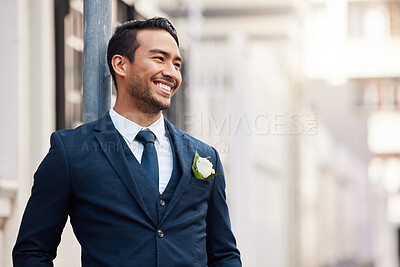 Buy stock photo Shot of a handsome young man standing  outdoors on his wedding day
