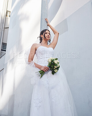 Buy stock photo Shot of a beautiful bride standing outside