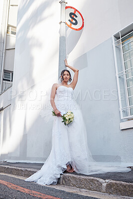 Buy stock photo Shot of a beautiful bride standing outside