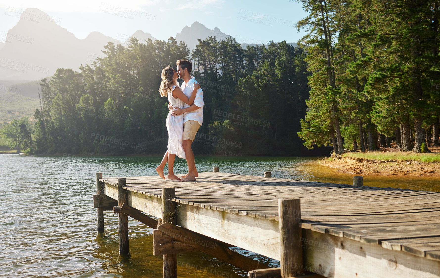 Buy stock photo Love, couple and dance at lake pier, smile and bonding together outdoors on vacation. Dancing date, having fun and happy man and woman on anniversary celebration for romantic holiday at summer creek.