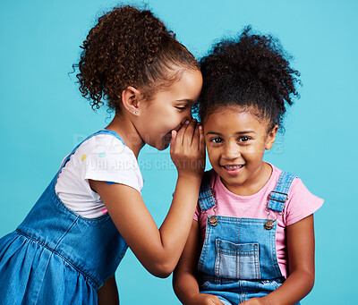 Buy stock photo Whisper, secret and friends with children in studio for gossip,  rumor and good news. Communication, mystery and innocence with young girls on blue background for conversation, secrecy or cute mockup