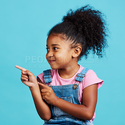 Buy stock photo Studio, youth girl and kid point at commercial promotion, advertising copy space or marketing mockup. Child growth mock up, brand product placement and young female face isolated on blue background