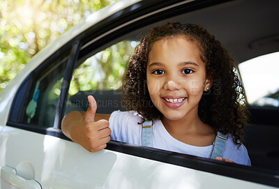 Buy stock photo Portrait, road trip and girl with a thumbs up in a car for travel, content with transportation and ride. Happy, review and a child with a hand gesture for transport satisfaction, approval and like