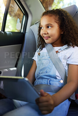 Buy stock photo Child in car, smile and tablet on road trip with seatbelt for safety and device to watch educational video or online game. Technology, internet and travel, happy girl on backseat for drive or carpool