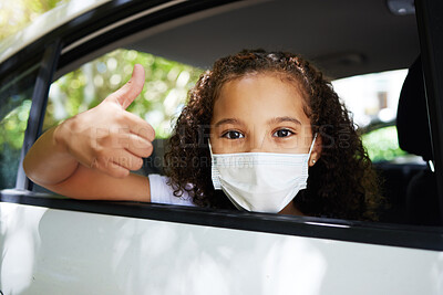 Buy stock photo Cropped portrait of an adorable little girl giving thumbs up through the back window of a car