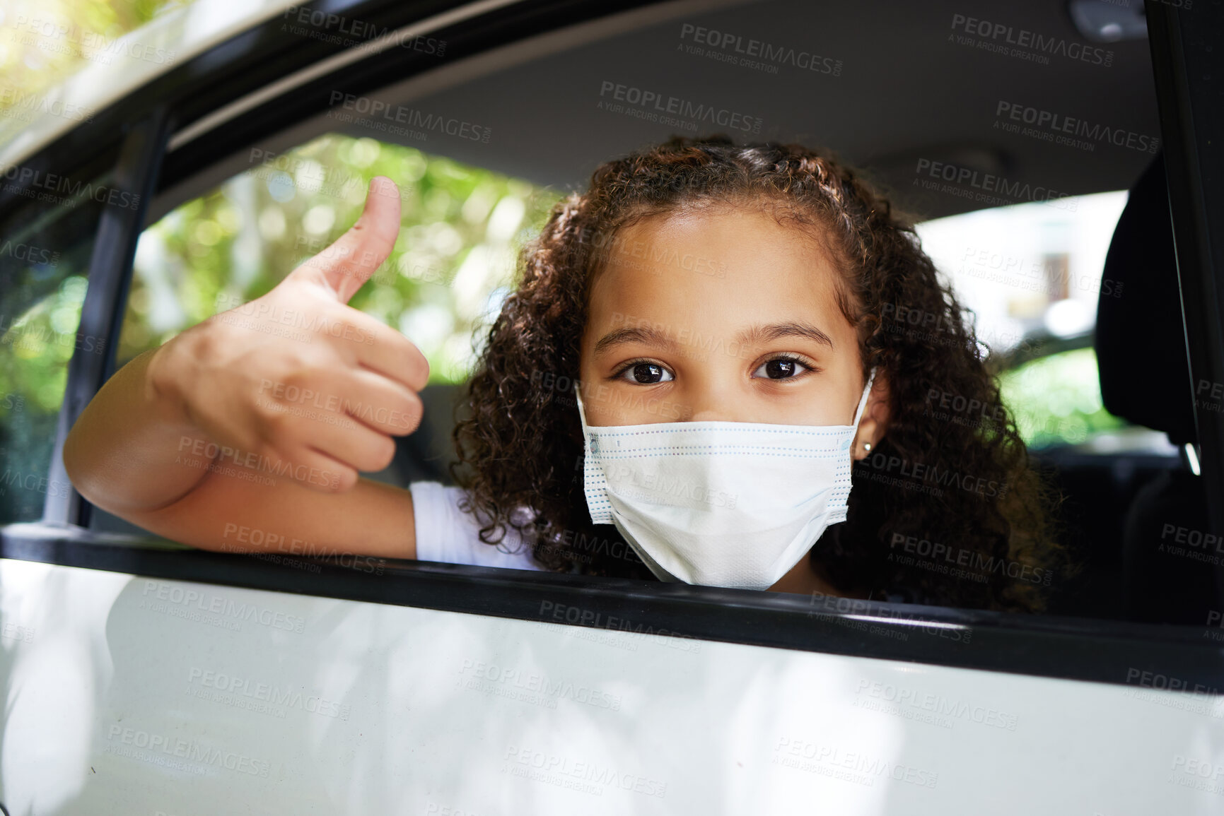 Buy stock photo Covid, thumbs up and portrait of a girl in a car for travel, road trip safety and compliance. Free, satisfaction and a little child showing a hand gesture with a face mask for protection in transport
