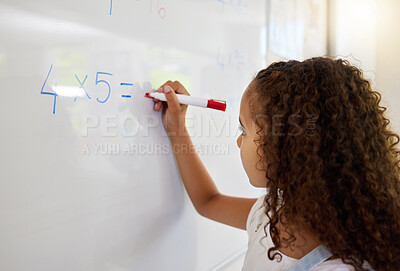Buy stock photo Whiteboard, math and girl writing for learning, studying and education in classroom. Development, mathematics and kid or student write equations, numbers and multiplication for knowledge in preschool
