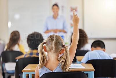 Buy stock photo Education, back and a child raising hand in class for a question, answer or vote at school. Teaching, academic and a student asking a teacher questions while learning, volunteering or voting