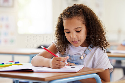 Buy stock photo Learning, drawing and girl in classroom for education, exam or studying with book. Preschool, creativity development and serious kid or student coloring for art in notebook in kindergarten or academy