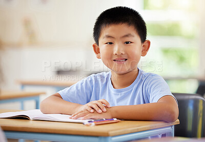 Buy stock photo Learning, portrait and Asian boy in classroom for education, exam or studying with book. Preschool, development growth and smile of happy kid and student from Japan in kindergarten for knowledge.