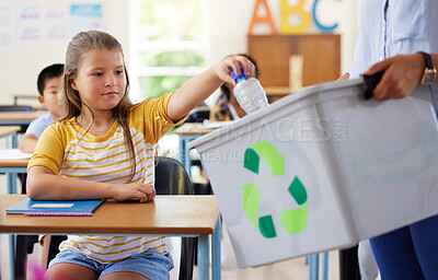 Buy stock photo Child, classroom and recycling plastic bottle with teacher for ecology, future and climate change education. Girl, box and recycle at school, class or helping hand for environment, earth and learning